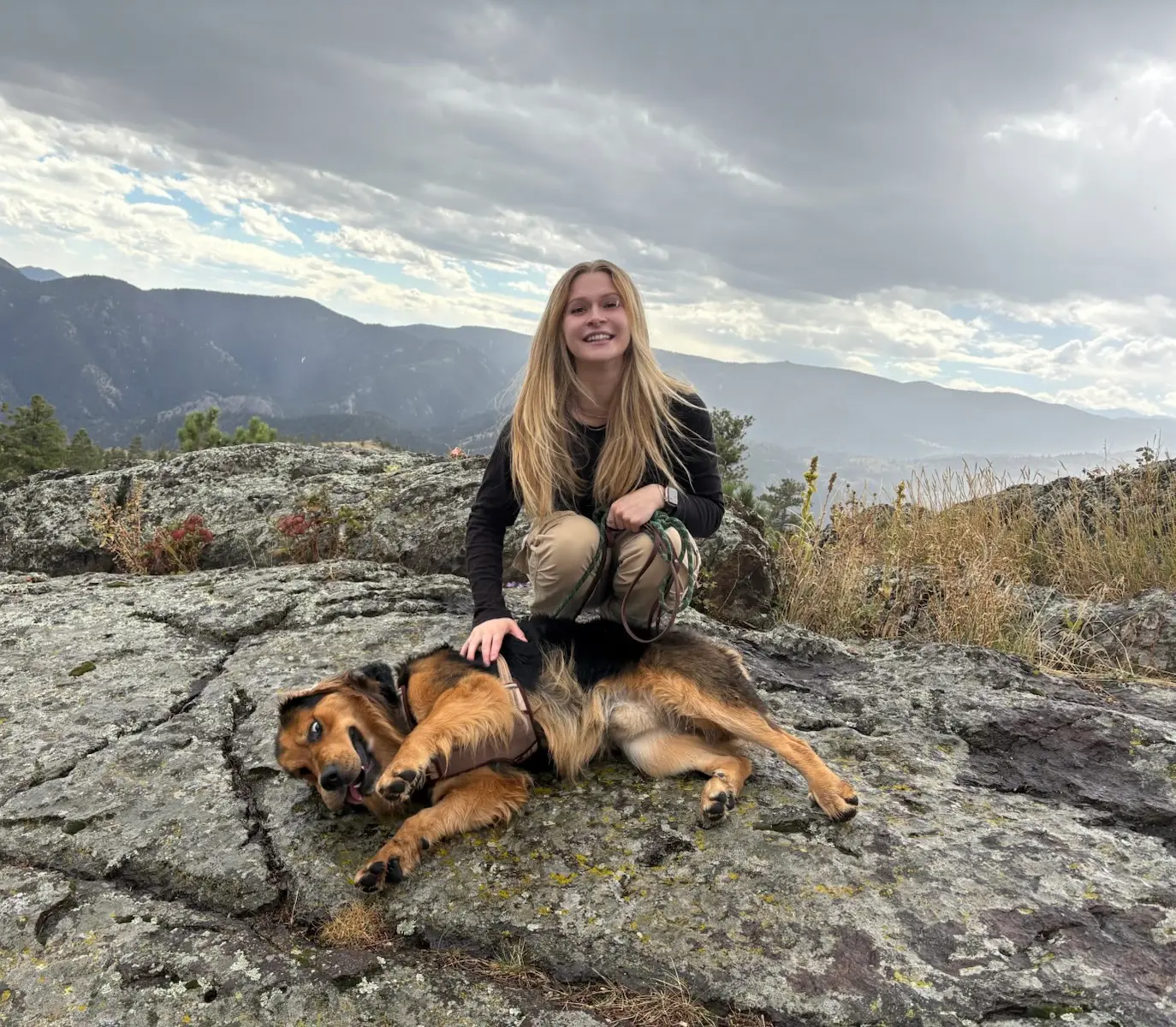 Lexie hiking with a large shepherd-mix dog in the Colorado mountains — dog sitting Denver