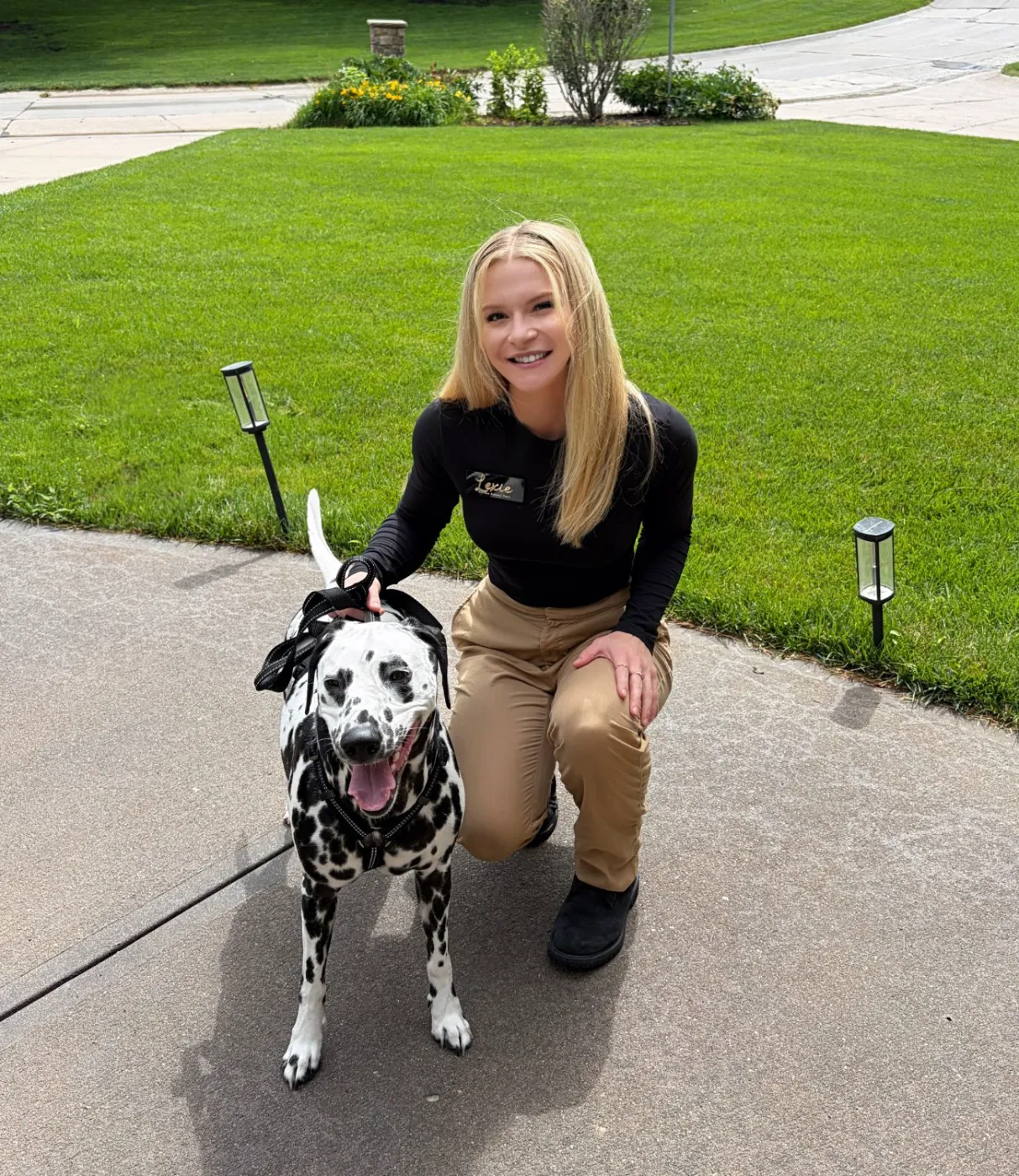 Lexie kneeling with a Dalmatian — dog sitting Littleton and Denver