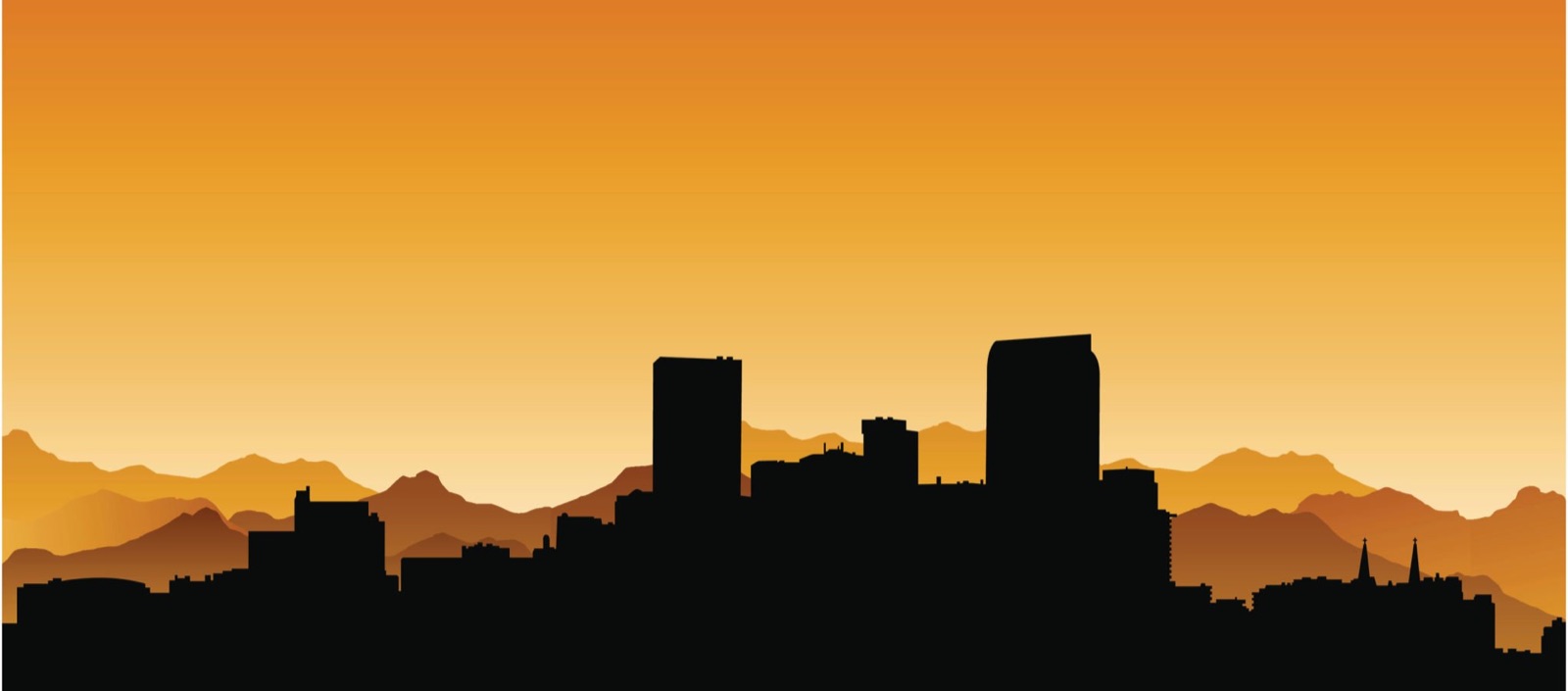 Denver skyline silhouette at sunset with the Rocky Mountains behind